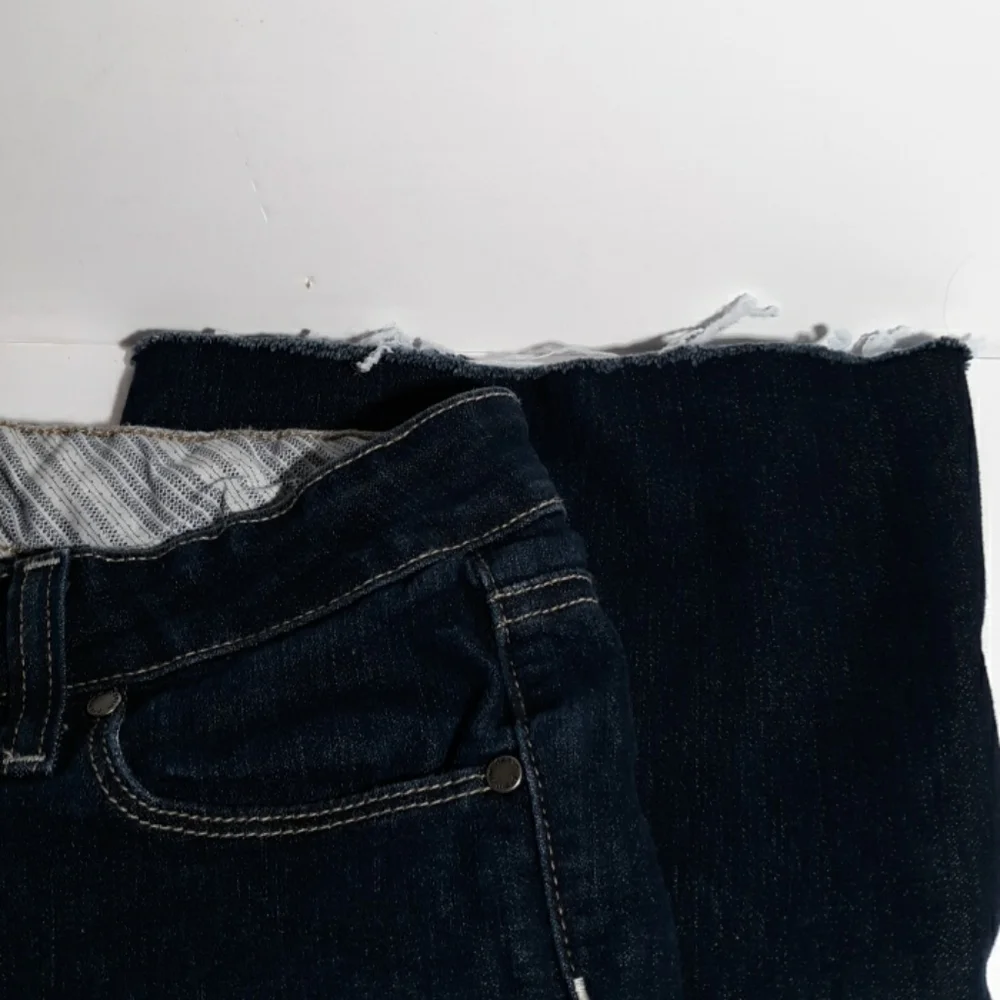 Paige 26 raw hem jeans boot cut
